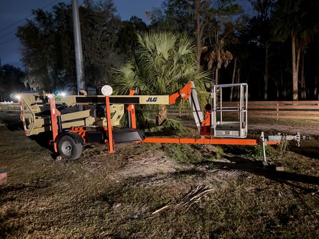 Truck and trailer with forestry equipment and cut tree debris